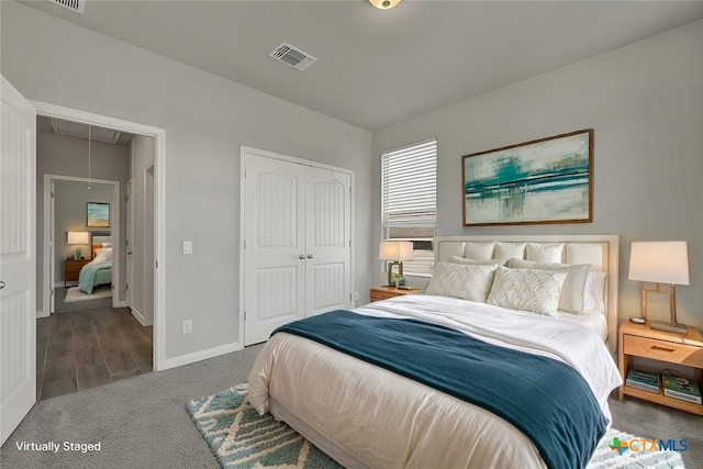 carpeted bedroom featuring a closet