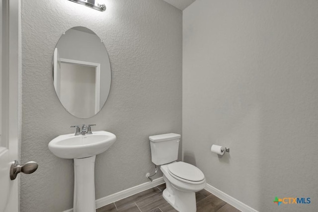 bathroom with sink and toilet