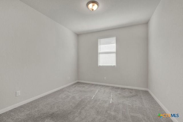 unfurnished room with light colored carpet