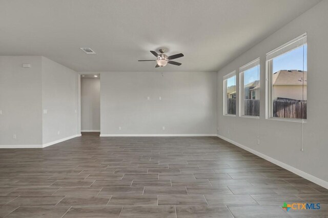 spare room featuring ceiling fan and hardwood / wood-style floors