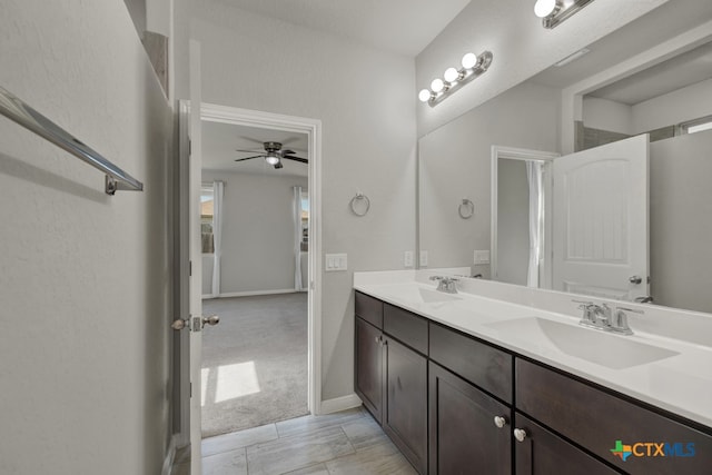 bathroom featuring ceiling fan and vanity