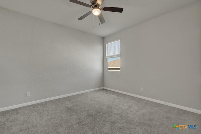 spare room with ceiling fan and carpet flooring