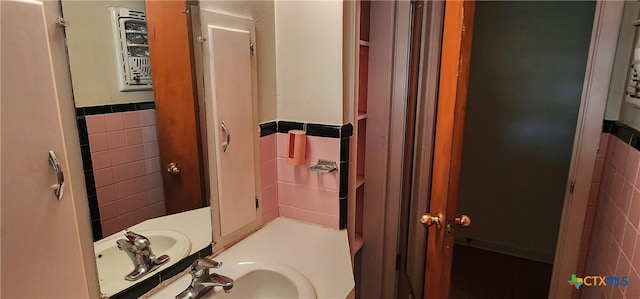 3605 Oaklawn St, Victoria, TX 77901 - bathroom featuring tile walls, a wainscoted wall, and vanity
