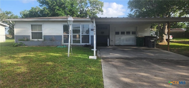 3605 Oaklawn St, Victoria, TX 77901 - view of front of house with asphalt driveway, an attached garage, a front yard, and an attached carport