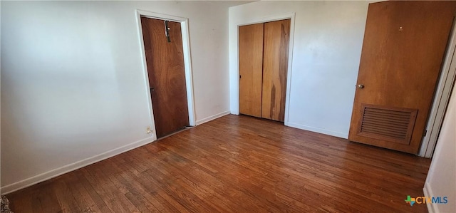 3605 Oaklawn St, Victoria, TX 77901 - unfurnished bedroom with wood finished floors and baseboards