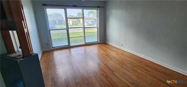 3605 Oaklawn St, Victoria, TX 77901 - spare room with baseboards and wood finished floors