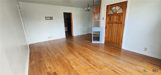 3605 Oaklawn St, Victoria, TX 77901 - empty room featuring a chandelier and hardwood / wood-style flooring