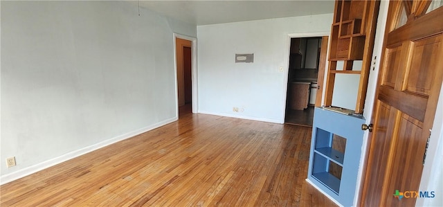 3605 Oaklawn St, Victoria, TX 77901 - unfurnished room with hardwood / wood-style flooring and baseboards