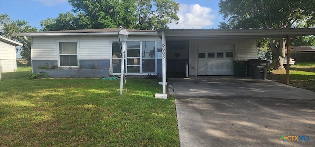 3605 Oaklawn St, Victoria, TX 77901 - view of front of house with an attached garage, asphalt driveway, a front lawn, and a carport
