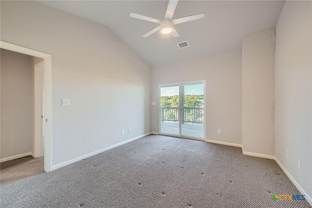 spare room featuring ceiling fan, lofted ceiling, and carpet floors