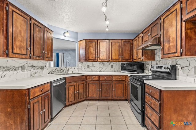 4210 Sand Dollar Dr, Killeen, TX 76549 - kitchen featuring appliances with stainless steel finishes, under cabinet range hood, tasteful backsplash, light tile patterned floors, and a textured ceiling