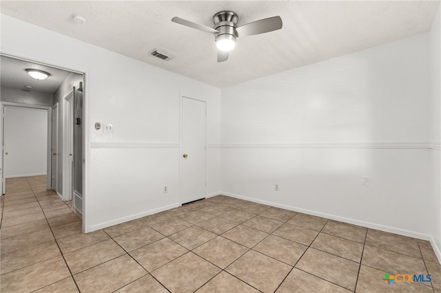 4210 Sand Dollar Dr, Killeen, TX 76549 - unfurnished room featuring a ceiling fan, light tile patterned floors, a textured ceiling, and a smoke detector