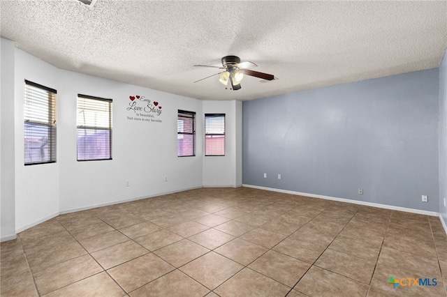 4210 Sand Dollar Dr, Killeen, TX 76549 - empty room with a ceiling fan, a textured ceiling, and light tile patterned floors