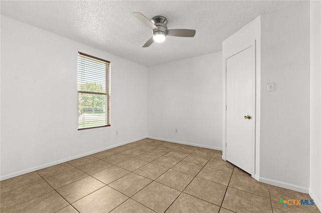 4210 Sand Dollar Dr, Killeen, TX 76549 - empty room featuring light tile patterned flooring, a ceiling fan, and a textured ceiling