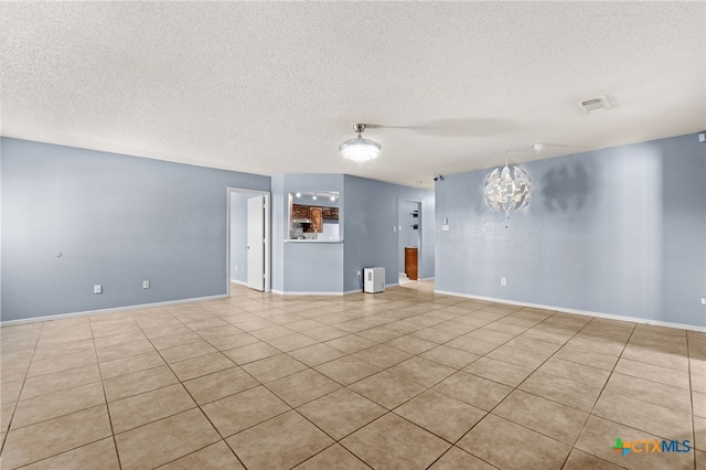 4210 Sand Dollar Dr, Killeen, TX 76549 - tiled empty room featuring a textured ceiling