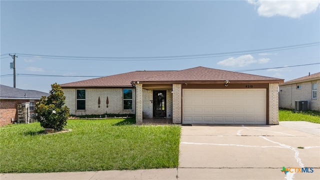 4210 Sand Dollar Dr, Killeen, TX 76549 - ranch-style home with brick siding, driveway, a garage, and a front lawn