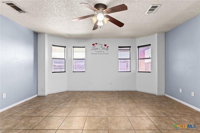 4210 Sand Dollar Dr, Killeen, TX 76549 - empty room with a ceiling fan, a textured ceiling, and light tile patterned flooring