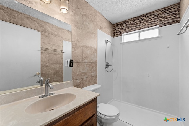 4210 Sand Dollar Dr, Killeen, TX 76549 - full bathroom featuring a shower, vanity, and a textured ceiling