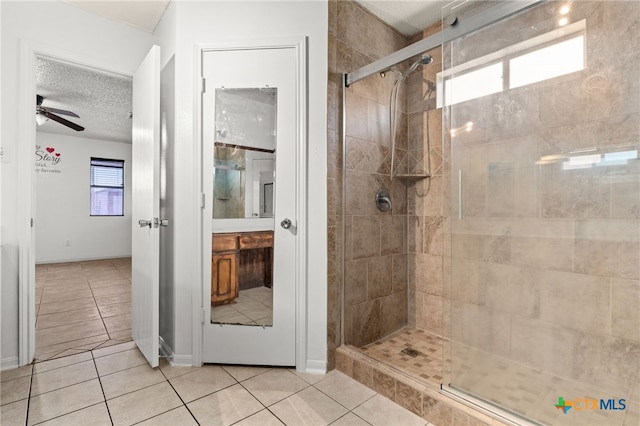 4210 Sand Dollar Dr, Killeen, TX 76549 - bathroom with a stall shower, tile patterned flooring, ceiling fan, vanity, and a textured ceiling