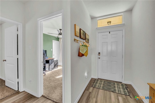 entrance foyer with ceiling fan and light hardwood / wood-style floors