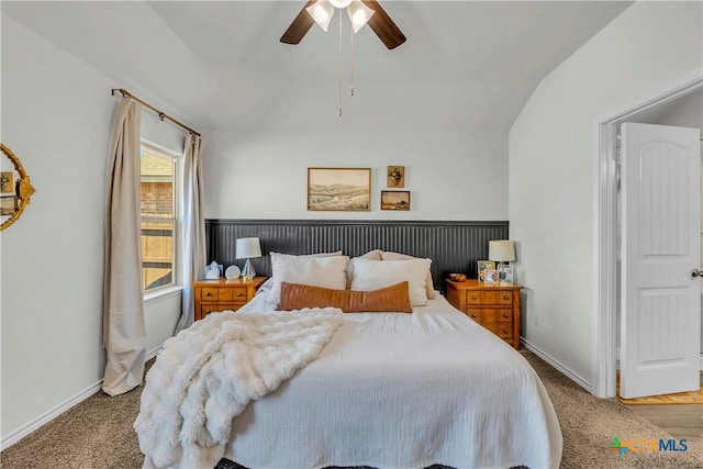 carpeted bedroom with lofted ceiling and ceiling fan