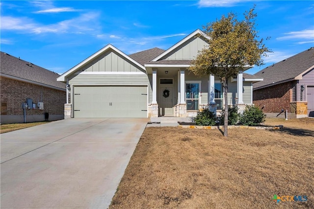 craftsman-style house with a garage, a front yard, and a porch