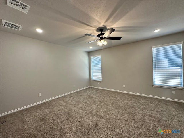 empty room with carpet floors and ceiling fan