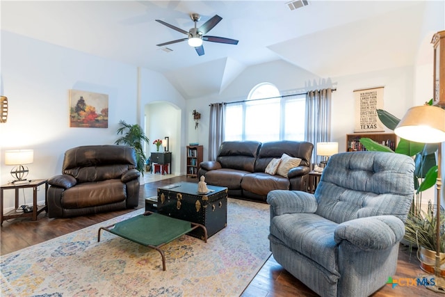 living room with dark hardwood / wood-style floors, ceiling fan, and vaulted ceiling