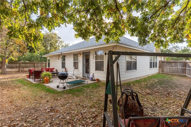 back of property featuring a patio