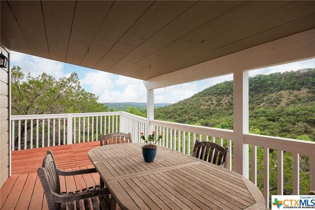 350 Climbing Way, Wimberley, TX 78676 - wooden deck with outdoor dining area