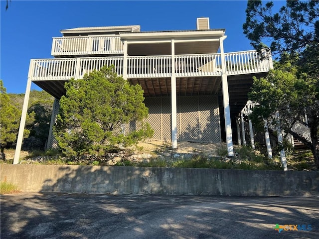 350 Climbing Way, Wimberley, TX 78676 - rear view of property with a wooden deck and a chimney