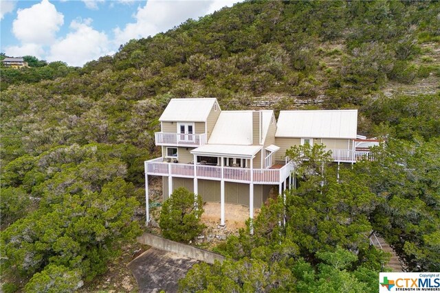 350 Climbing Way, Wimberley, TX 78676 - back of property featuring a forest view and a balcony