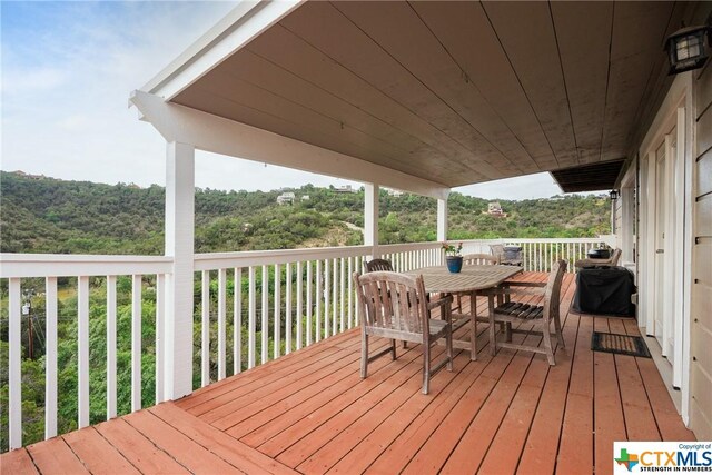 350 Climbing Way, Wimberley, TX 78676 - wooden terrace featuring outdoor dining area