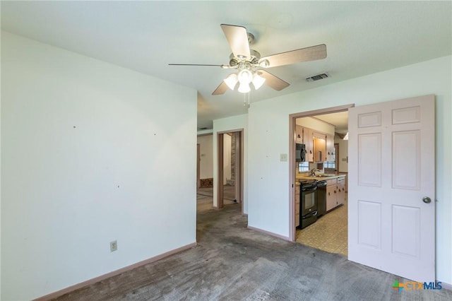 empty room with a ceiling fan, baseboards, visible vents, and a sink