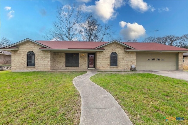 single story home featuring concrete driveway, brick siding, an attached garage, and a front lawn