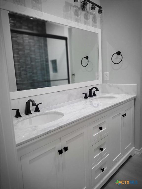 1211 W Houson Ave, Seadrift, TX 77983 - bathroom with double vanity and a sink