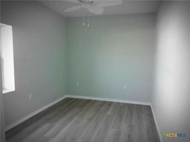 1211 W Houson Ave, Seadrift, TX 77983 - empty room featuring wood finished floors, a ceiling fan, and baseboards