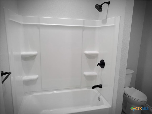 1211 W Houson Ave, Seadrift, TX 77983 - full bathroom with tub / shower combination, toilet, and a textured wall