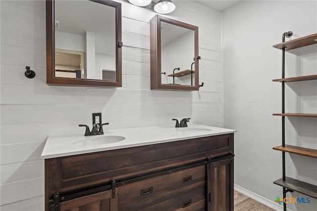 4101 Briar Cliff Rd, Temple, TX 76502 - bathroom featuring double vanity and wood finished floors