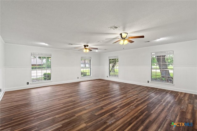 4101 Briar Cliff Rd, Temple, TX 76502 - spare room featuring plenty of natural light, ceiling fan, dark wood-style flooring, and a textured ceiling
