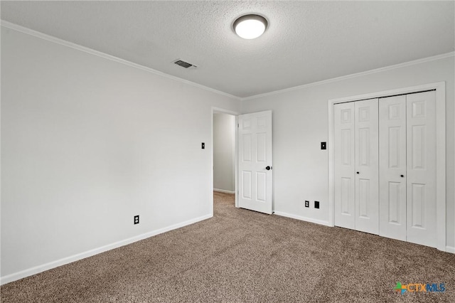 4101 Briar Cliff Rd, Temple, TX 76502 - unfurnished bedroom featuring carpet floors, a textured ceiling, crown molding, and a closet