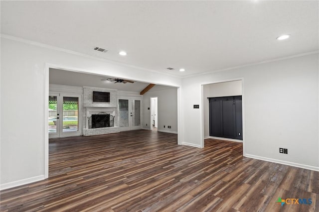 4101 Briar Cliff Rd, Temple, TX 76502 - unfurnished living room featuring crown molding, dark wood finished floors, a fireplace, recessed lighting, and a ceiling fan