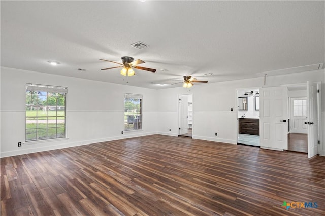 4101 Briar Cliff Rd, Temple, TX 76502 - unfurnished living room with a ceiling fan, dark wood-style floors, and a textured ceiling