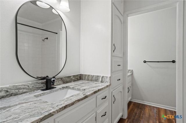 4101 Briar Cliff Rd, Temple, TX 76502 - full bathroom with vanity, wood finished floors, ornamental molding, and a shower
