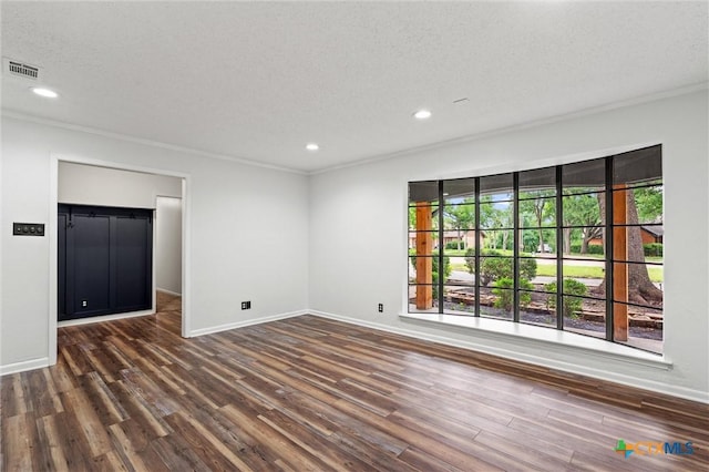 4101 Briar Cliff Rd, Temple, TX 76502 - spare room featuring crown molding, wood finished floors, recessed lighting, and a textured ceiling