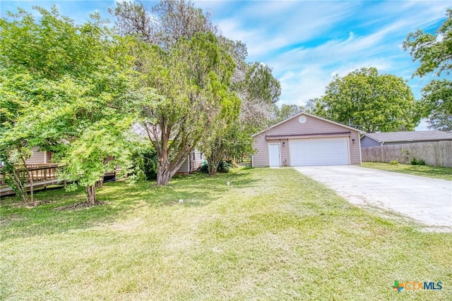 view of front of property with a deck and a front lawn