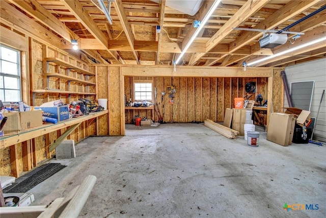 misc room featuring a workshop area and concrete flooring