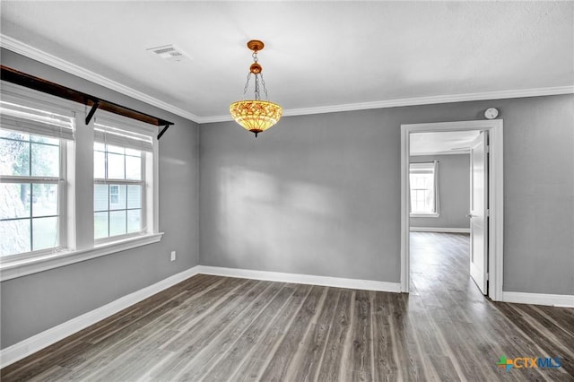 spare room with dark hardwood / wood-style flooring and ornamental molding