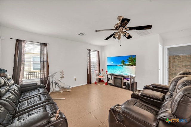 tiled living room with ceiling fan