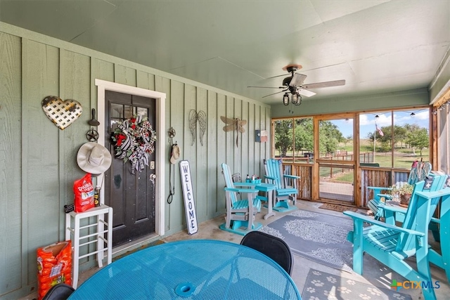 sunroom featuring ceiling fan